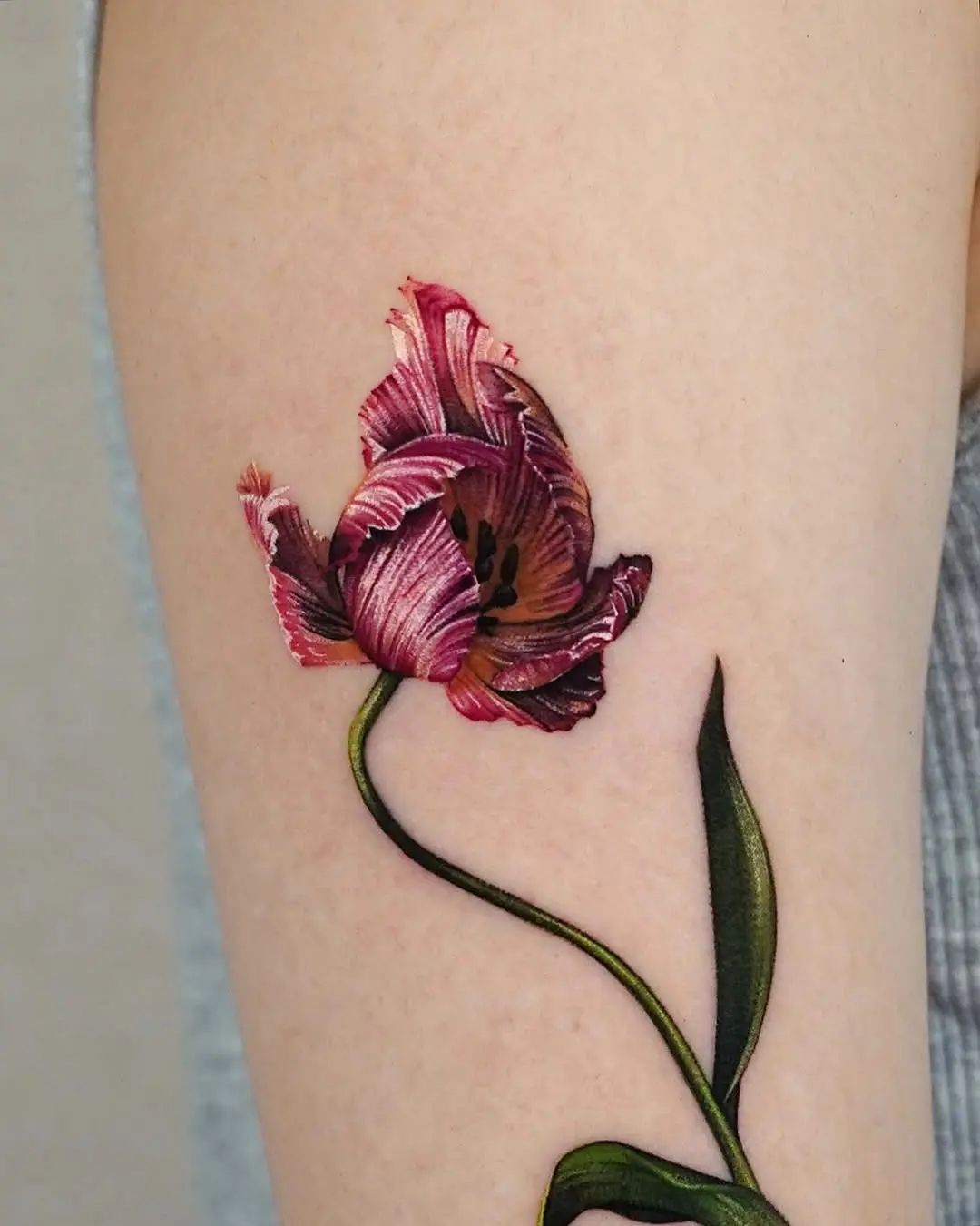 Stunning tulip tattoo blooming vividly on skin