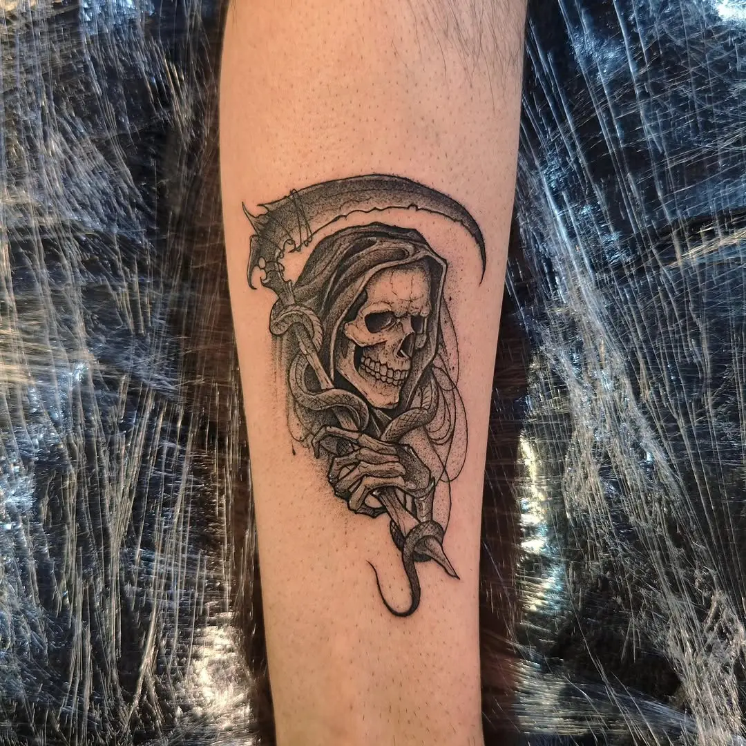 Intricate Santa Muerte tattoo with skull and scythe