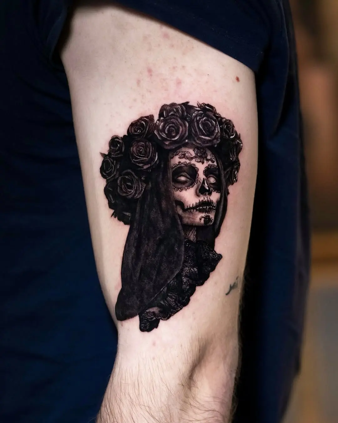 Intricate Santa Muerte tattoo with roses and veil