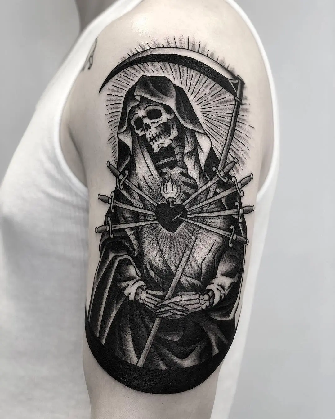 Striking Santa Muerte tattoo with swords and heart