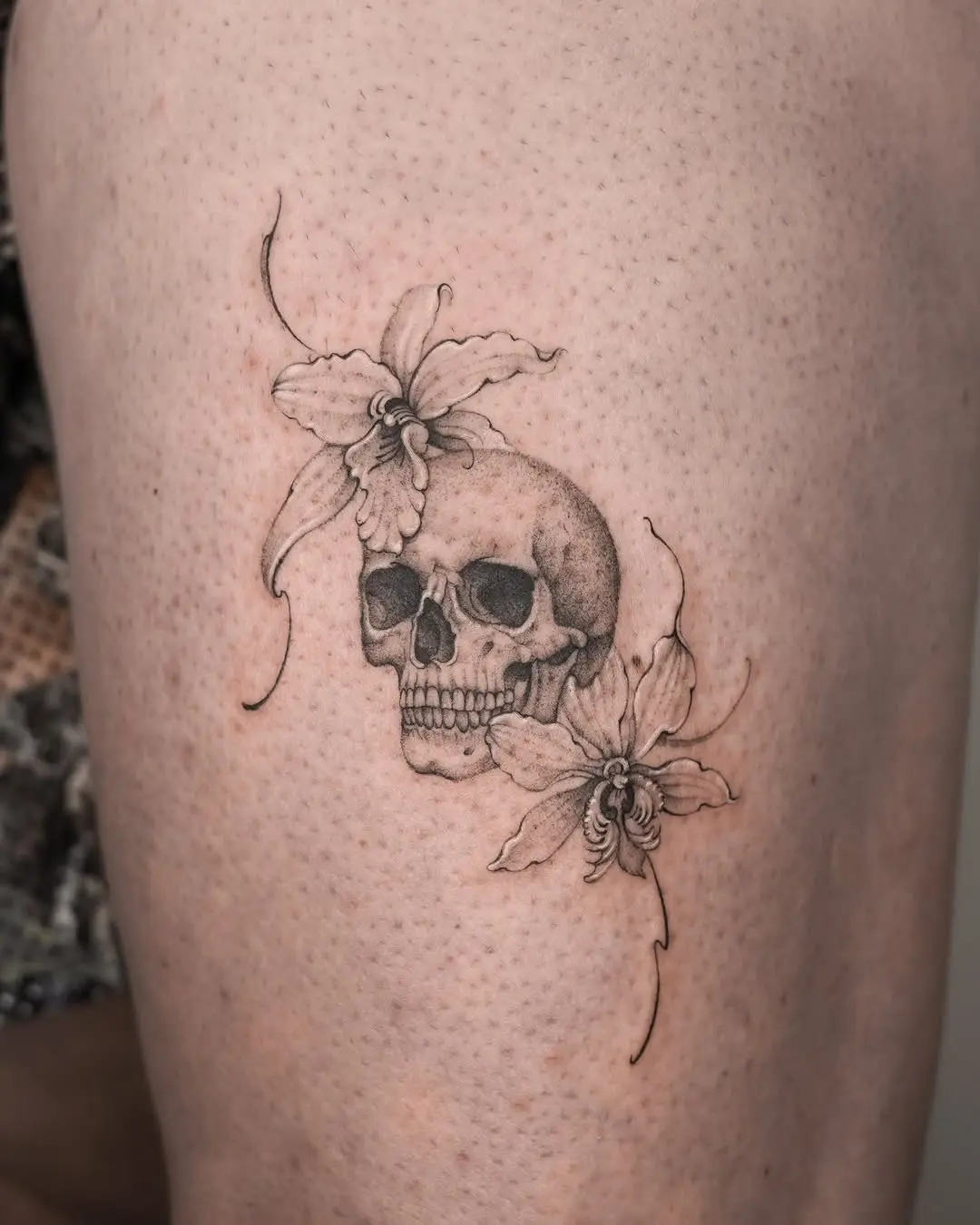 Elegant skull surrounded by delicate flowers