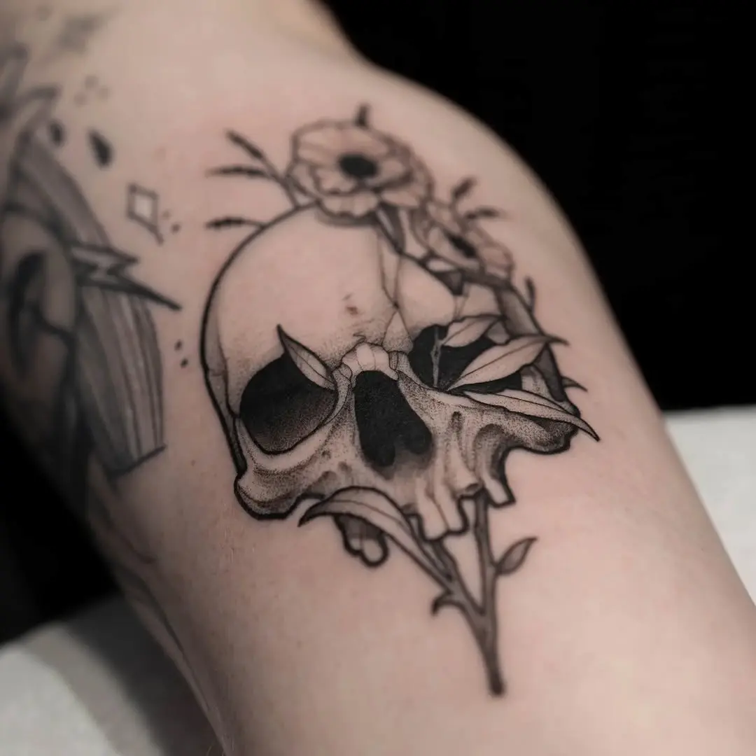 Gothic skull flower tattoo with intricate details