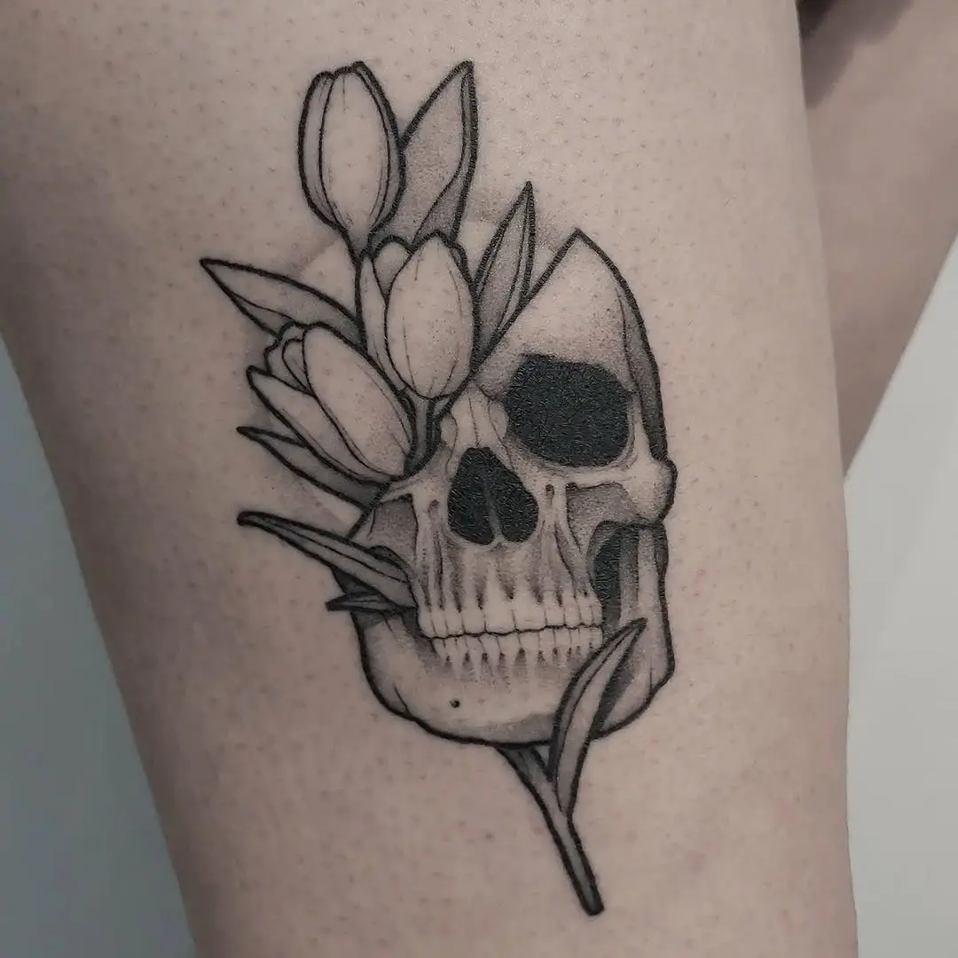 Unique skull tattoo adorned with flowers