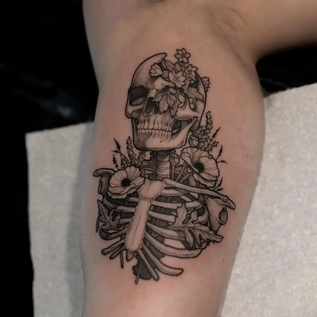 A stunning skull entwined with beautiful flowers
