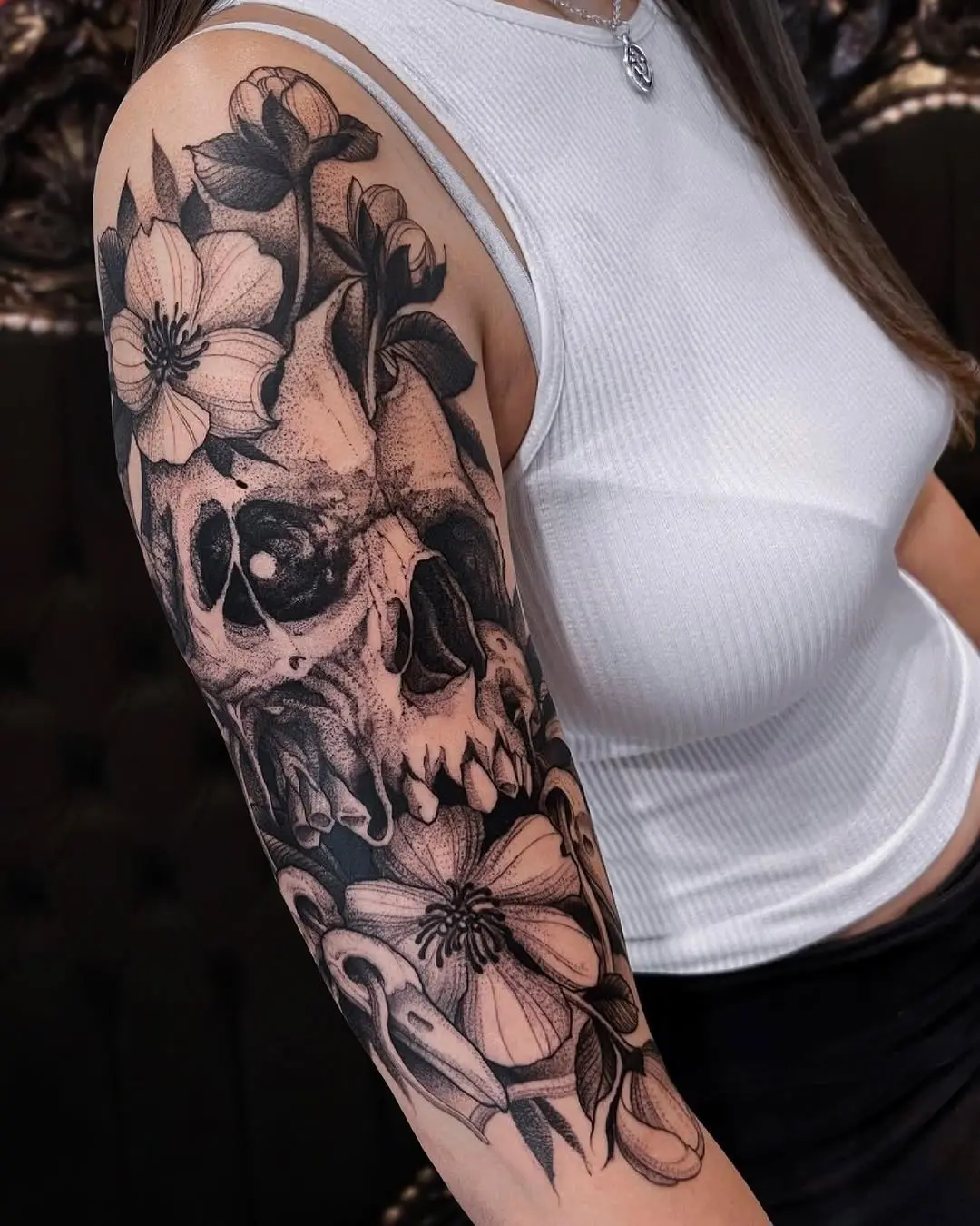 Intricate Skull and Flower Tattoo on Arm