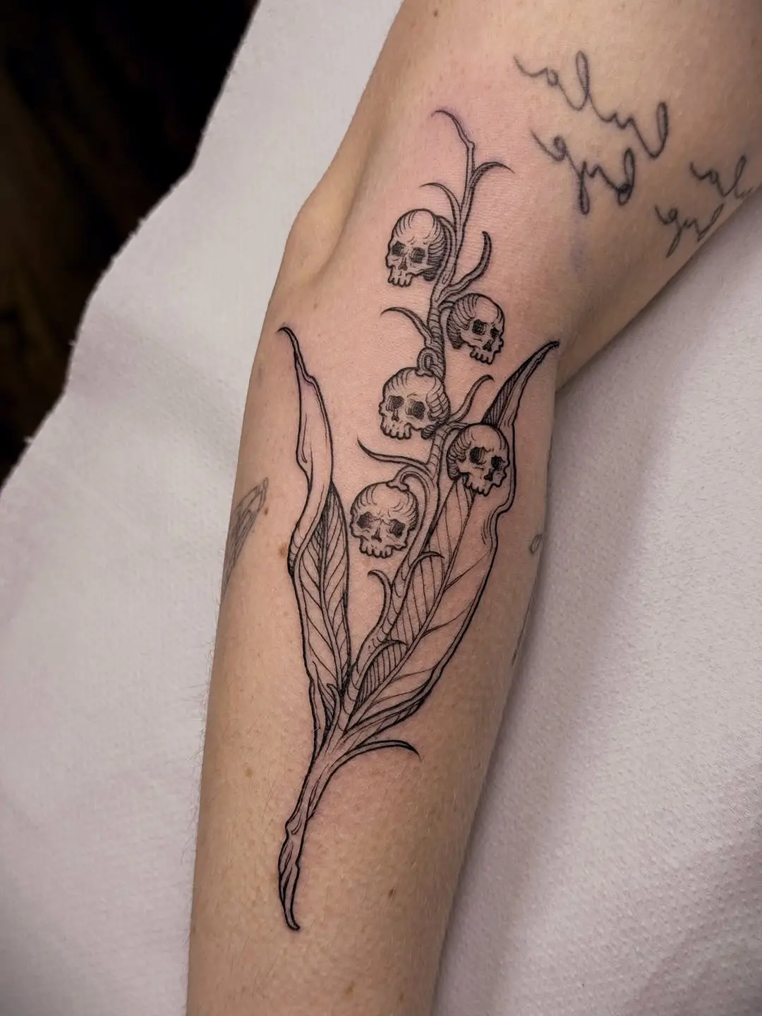 Unique Skull and Flower Tattoo Design
