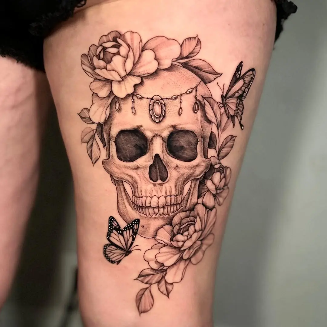 Elegant skull adorned with flowers and butterflies