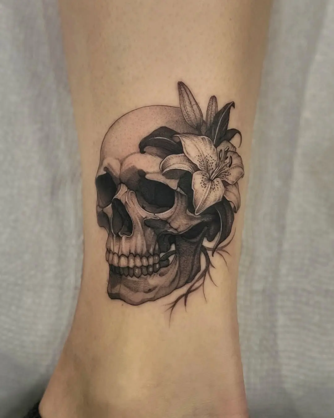 Intricate skull tattoo with floral accents