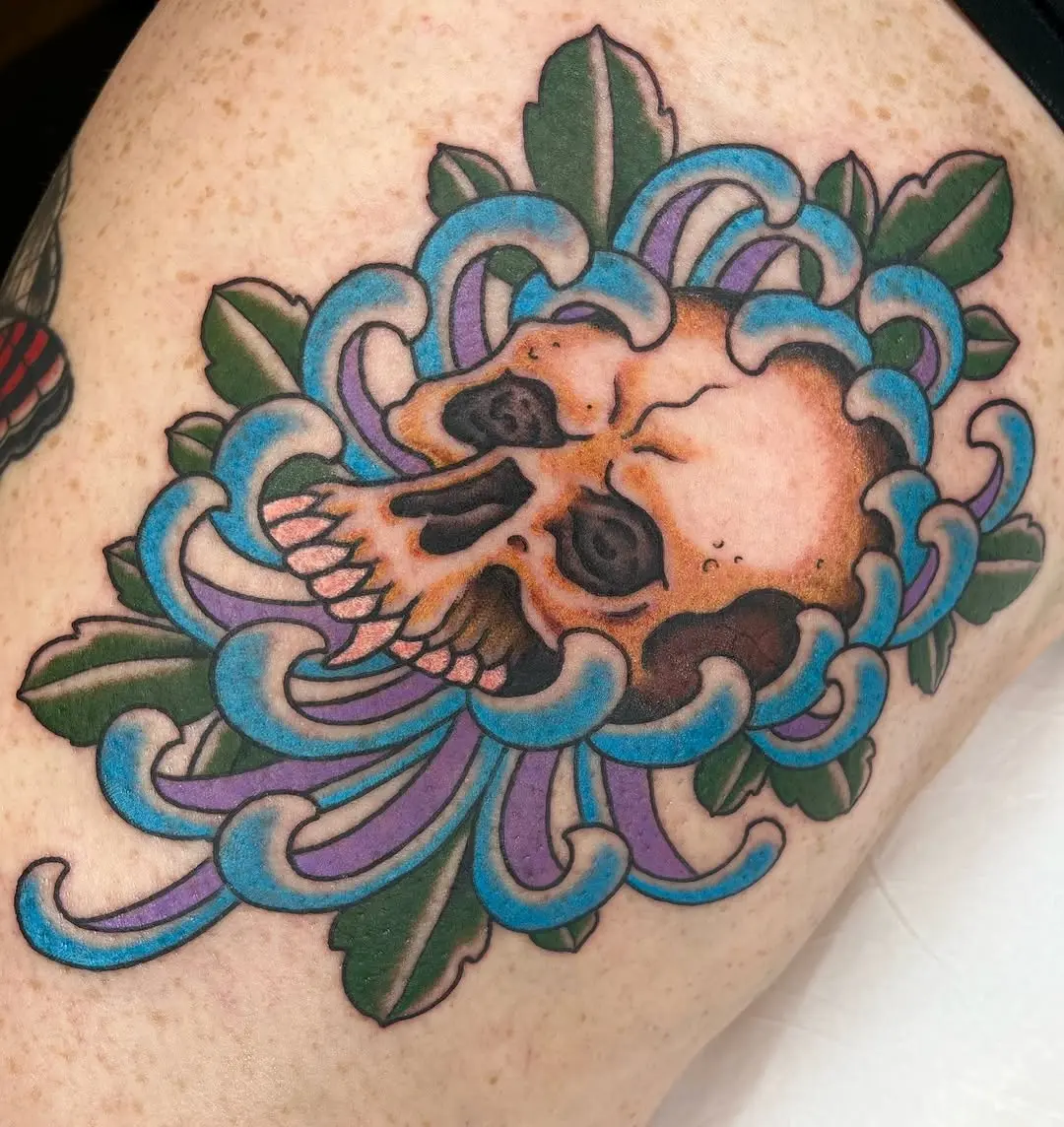 Intricate skull flower tattoo with vibrant colors