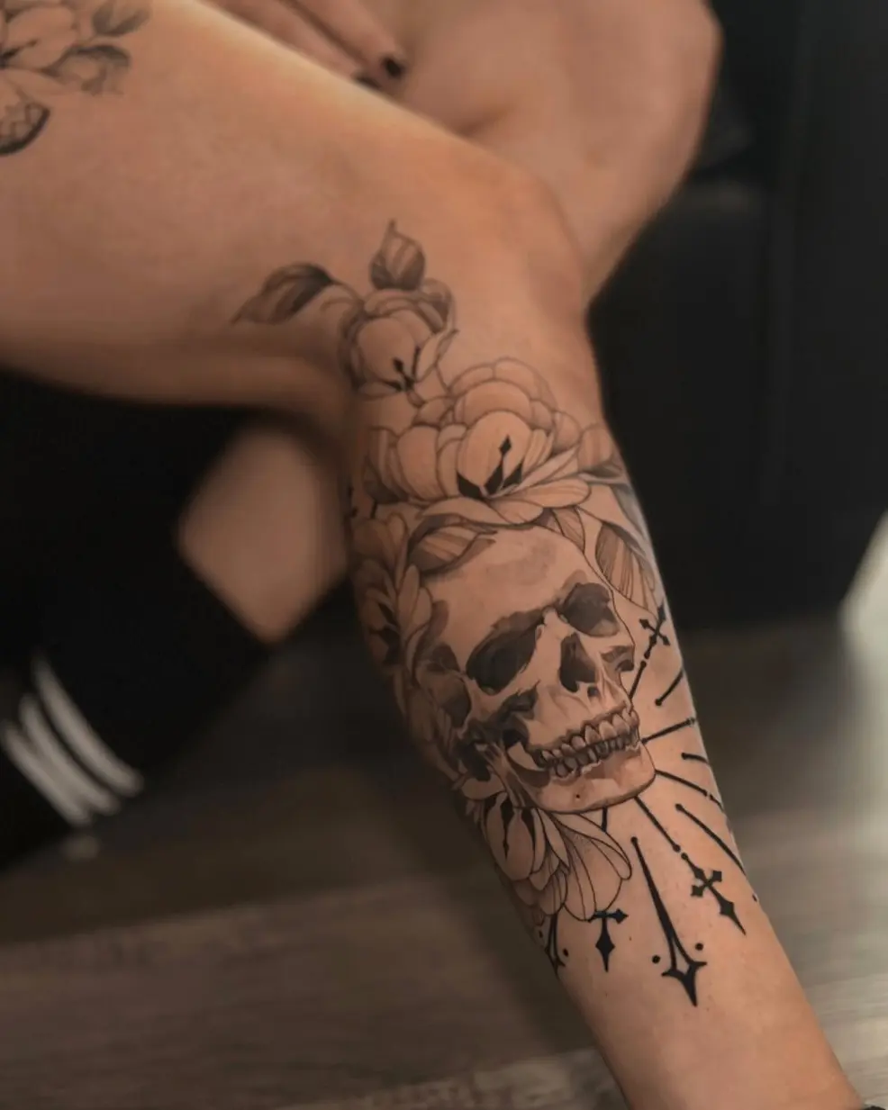 Bold skull entwined with delicate flowers