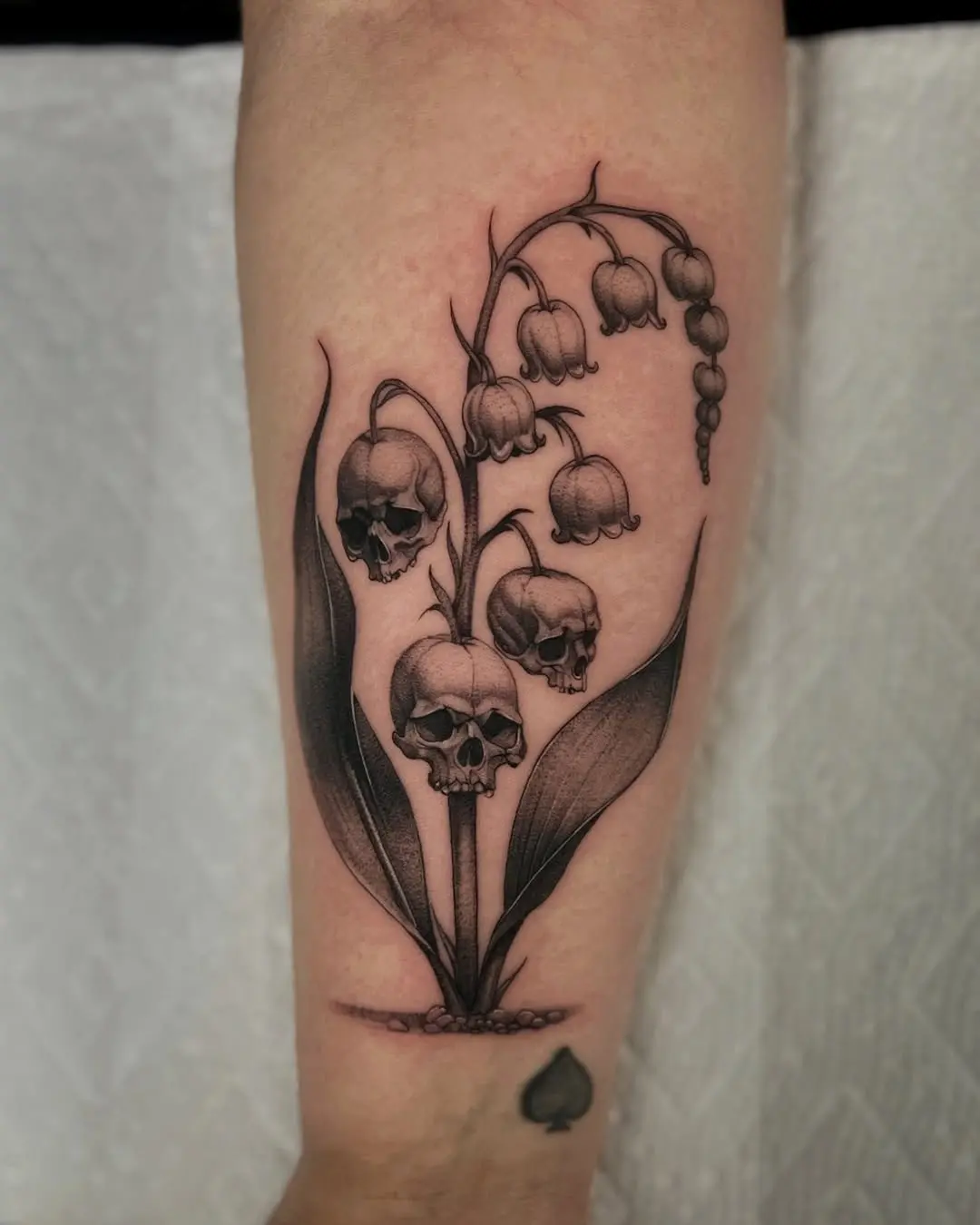 Intricate skull flower tattoo with gothic vibes