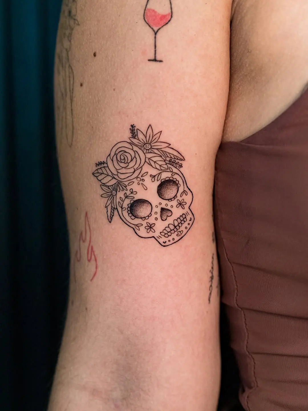 Unique skull and flower tattoo design inspiration