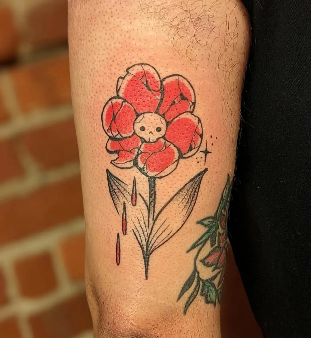 Bold and vibrant skull flower tattoo design