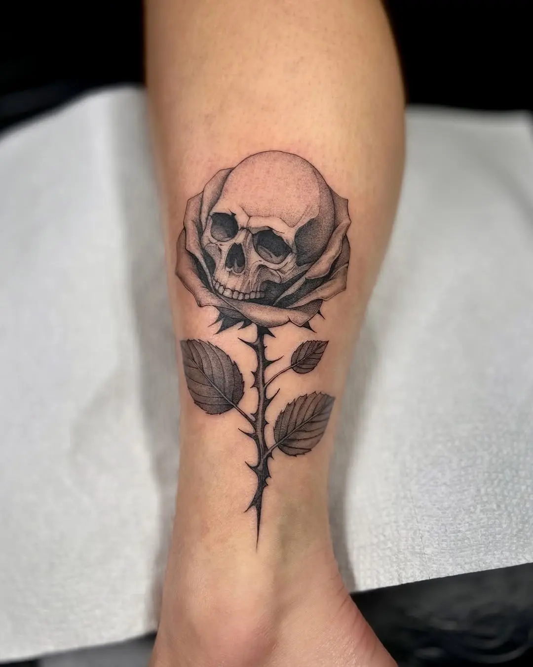 Striking skull flower tattoo with a gothic flair