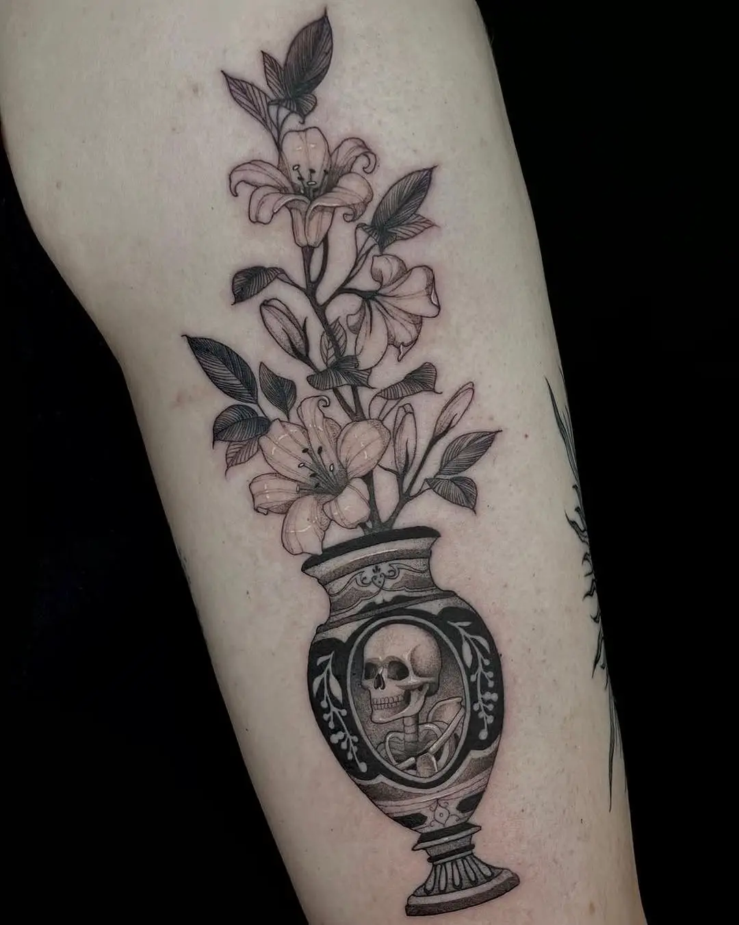 Elegant tattoo blending flowers and skulls