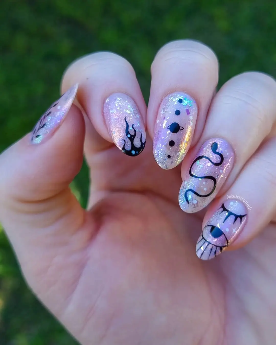 Enchanting glittery nails with mystical designs