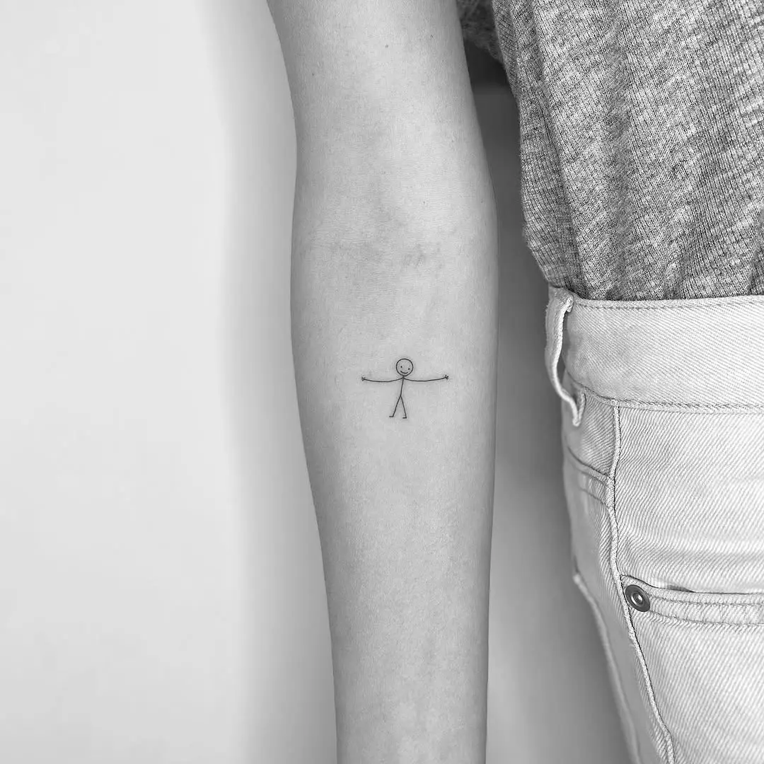Charming minimalist stick figure tattoo design