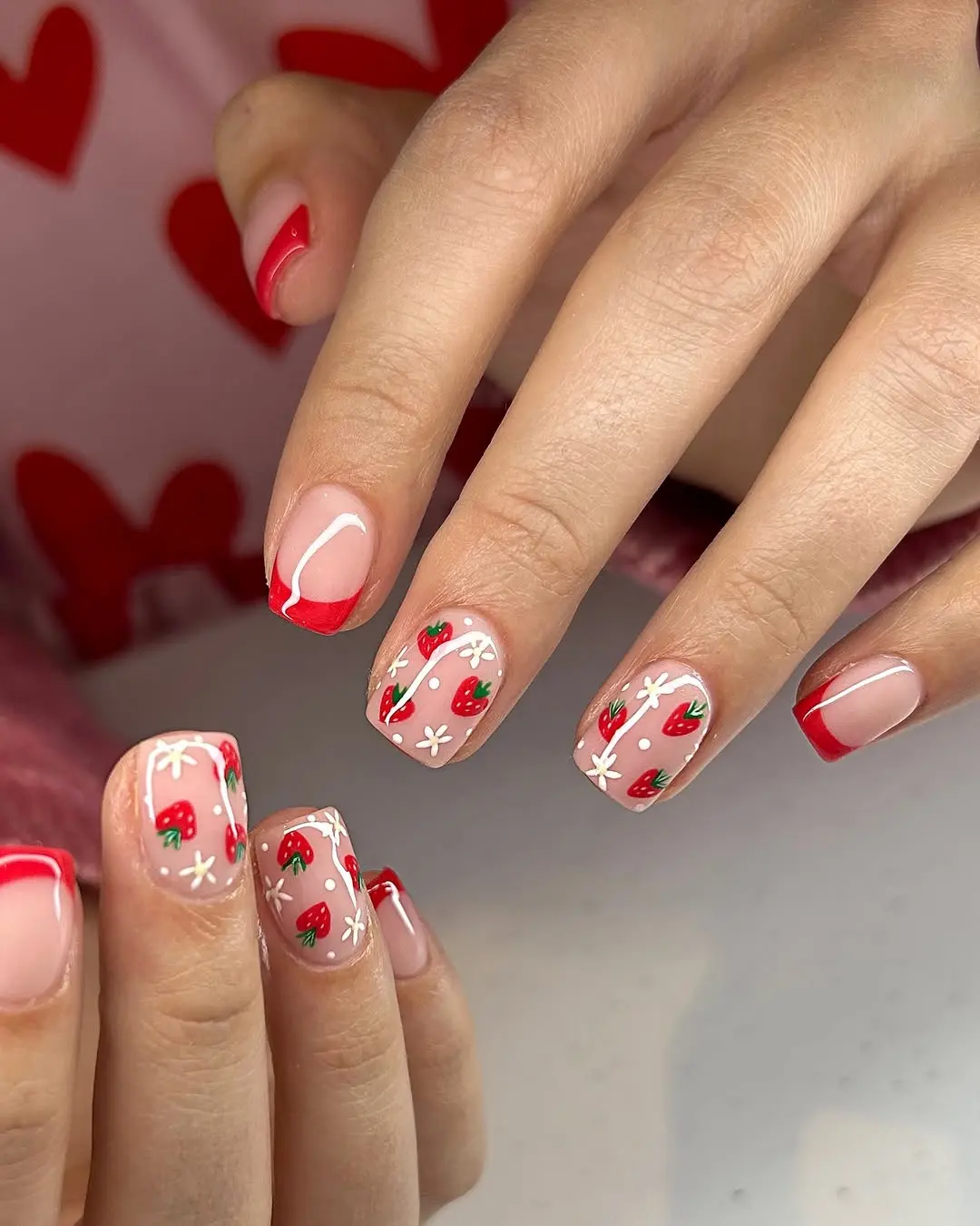 Vibrant strawberry-themed nail art design