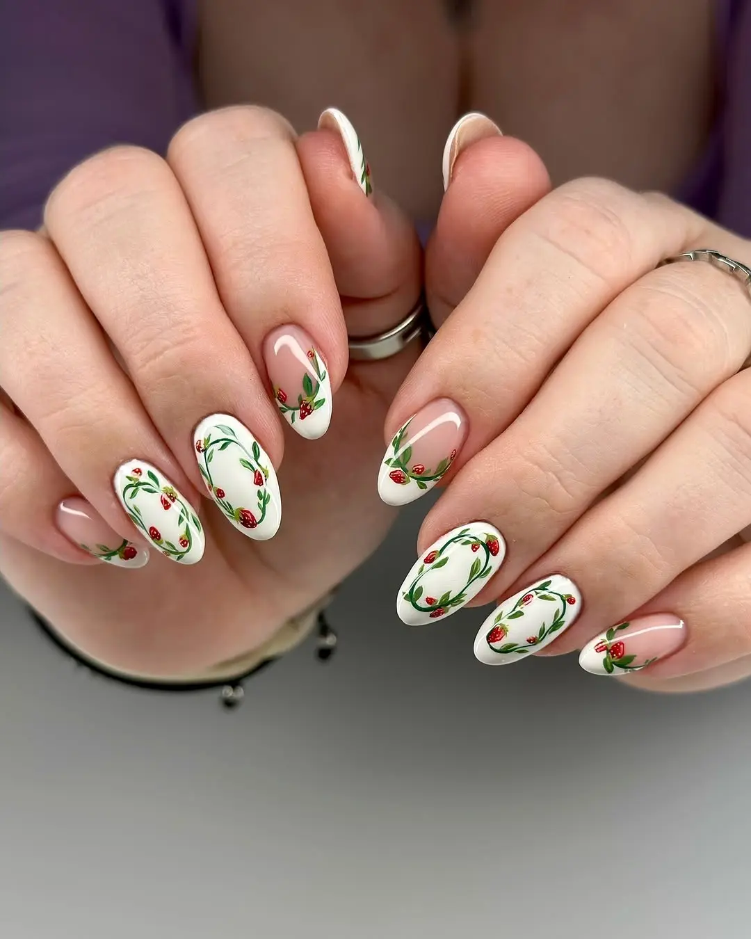Charming strawberry nail art with floral accents