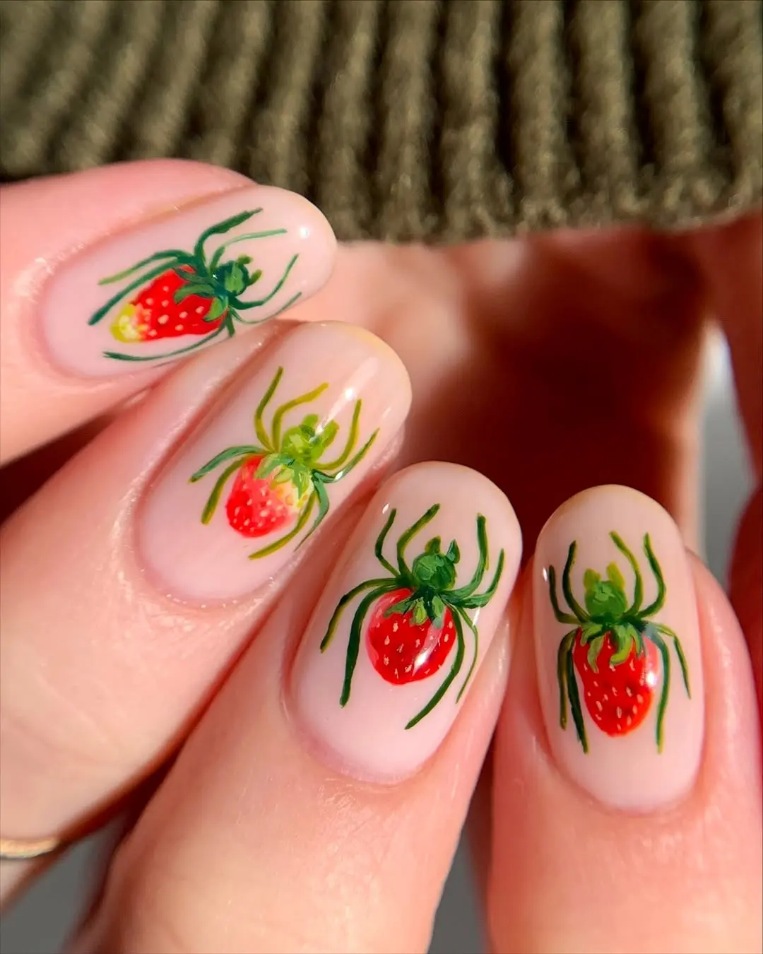 Vibrant strawberry-themed nail art design