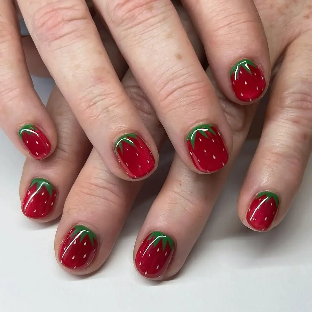 Vibrant Strawberry Nails with Green Accents
