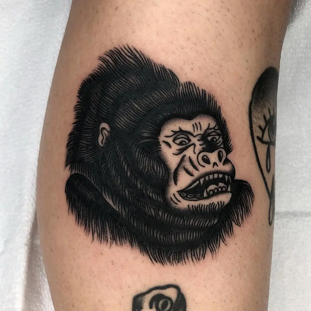Intricate depiction of a fierce gorilla tattoo