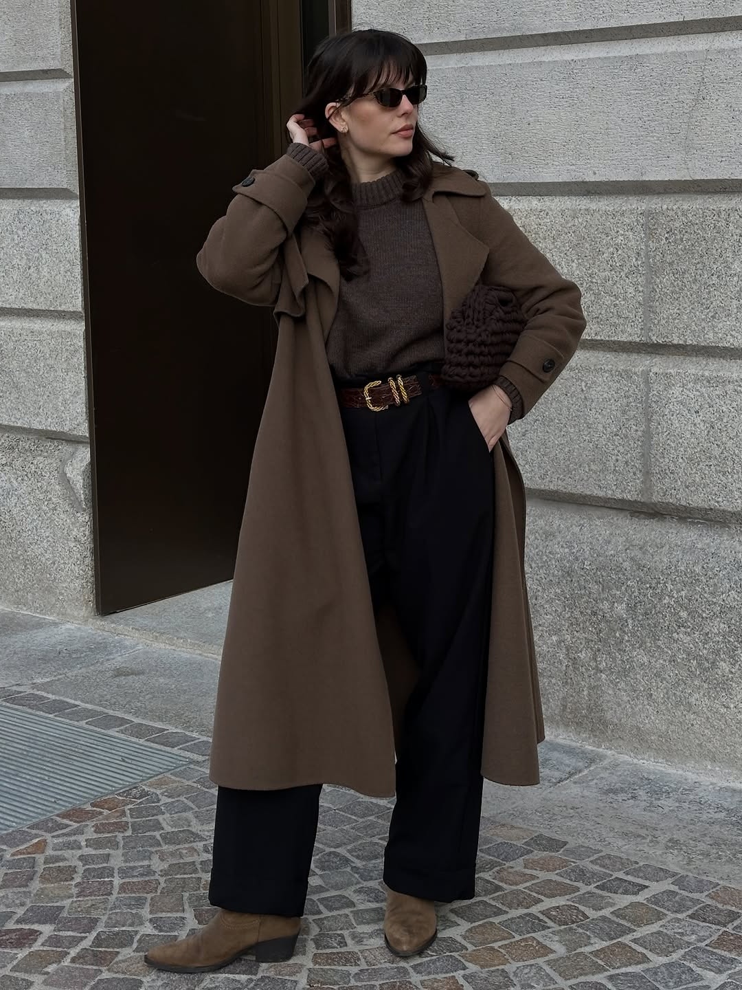 Chic trench coat over cozy sweater ensemble