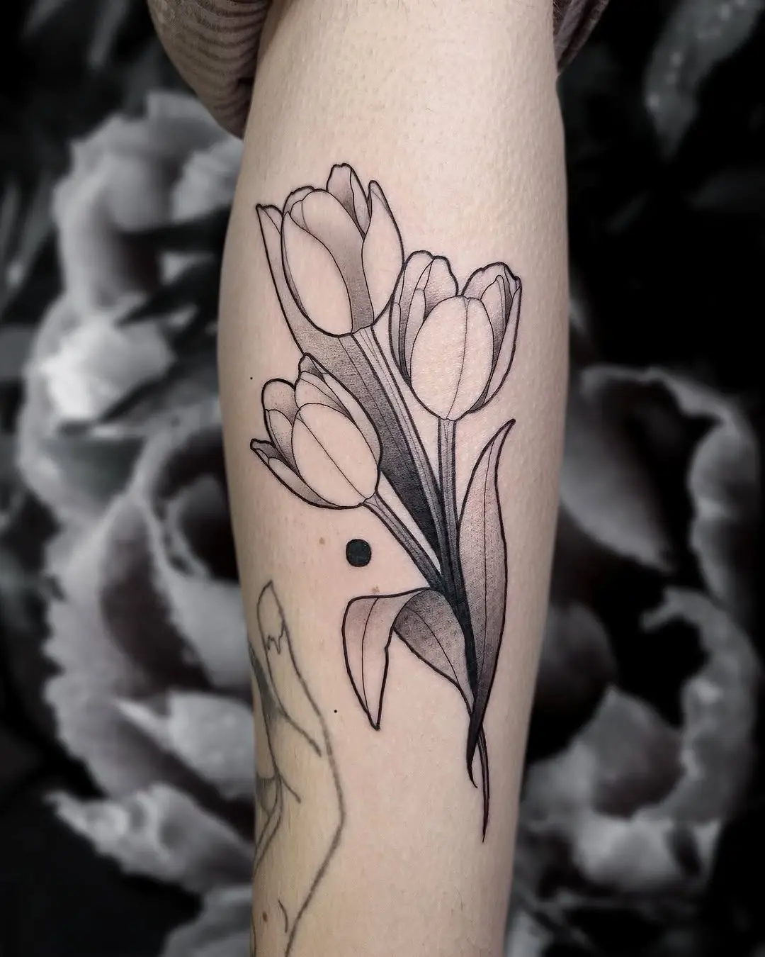 Elegant tulip tattoo design with subtle details
