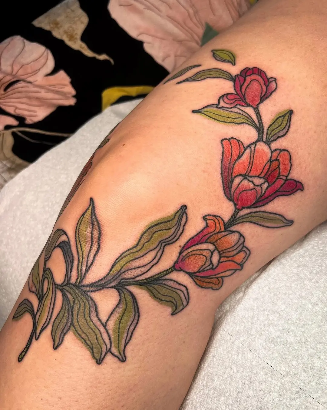 Elegant tulip tattoo showcasing vibrant colors