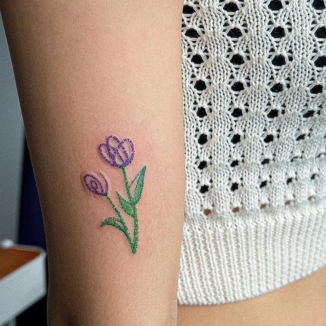 Delicate tulip design for floral tattoo lovers