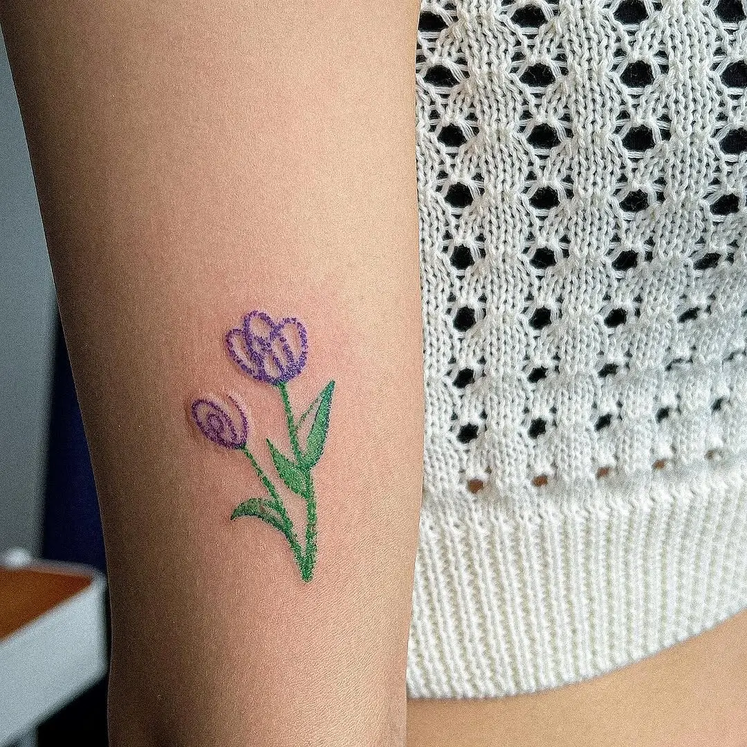 Delicate tulip design for floral tattoo lovers