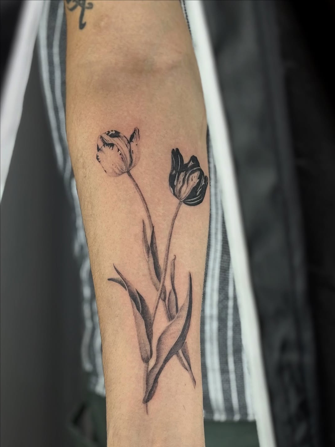 Stylish black and white tulip tattoo design