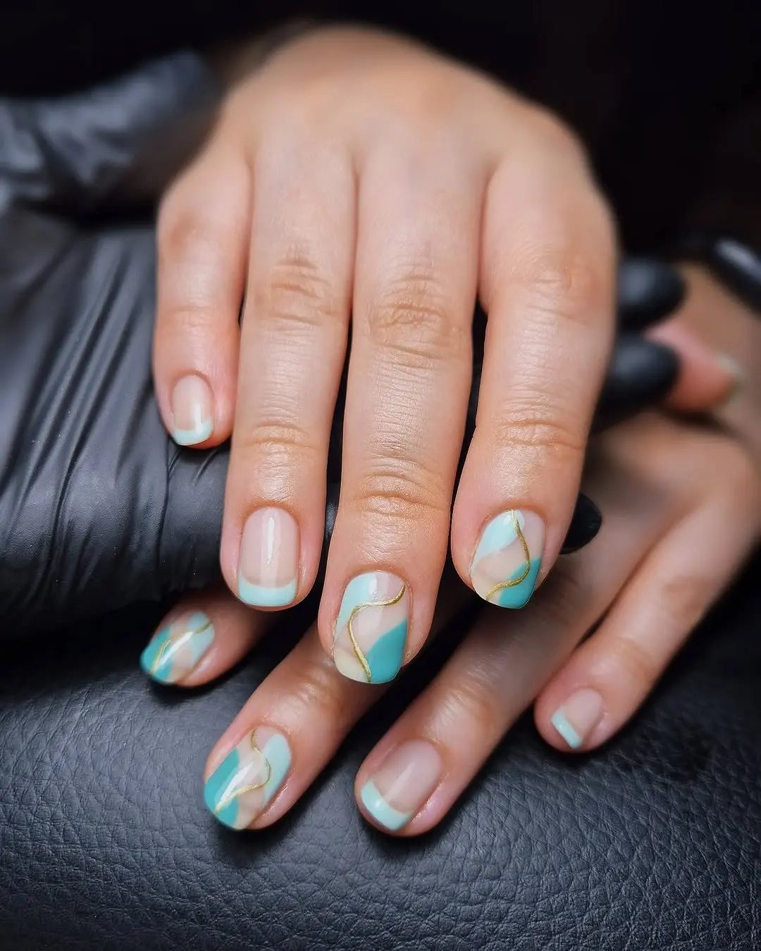 Artistic turquoise French tip nail design