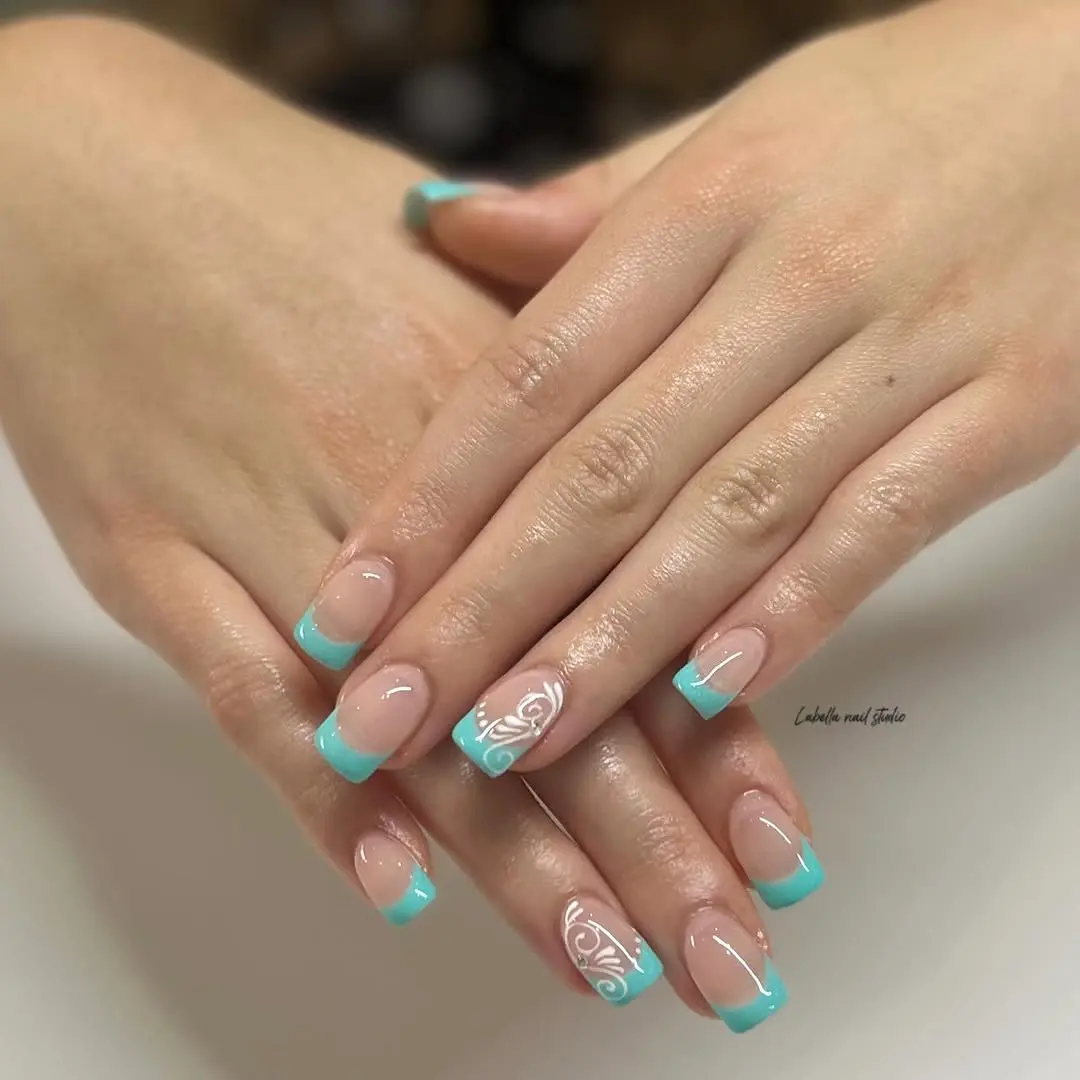 Elegant turquoise tips with intricate nail art
