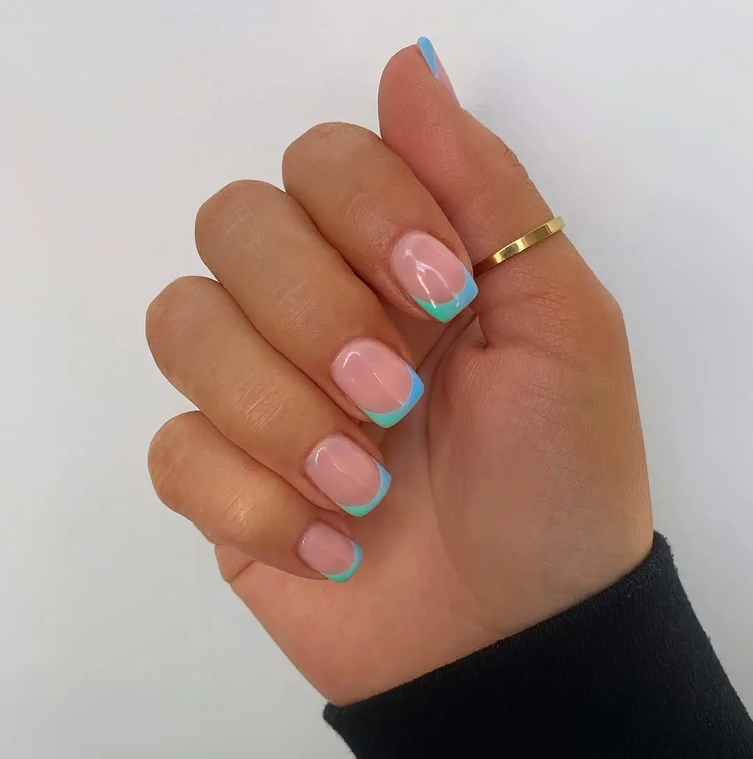 Chic turquoise French tips with subtle elegance