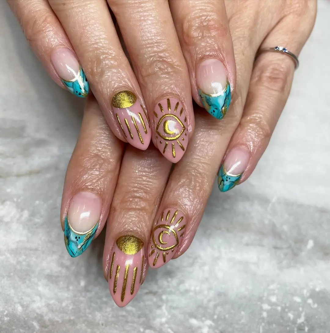 Chic turquoise French tips with gold accents