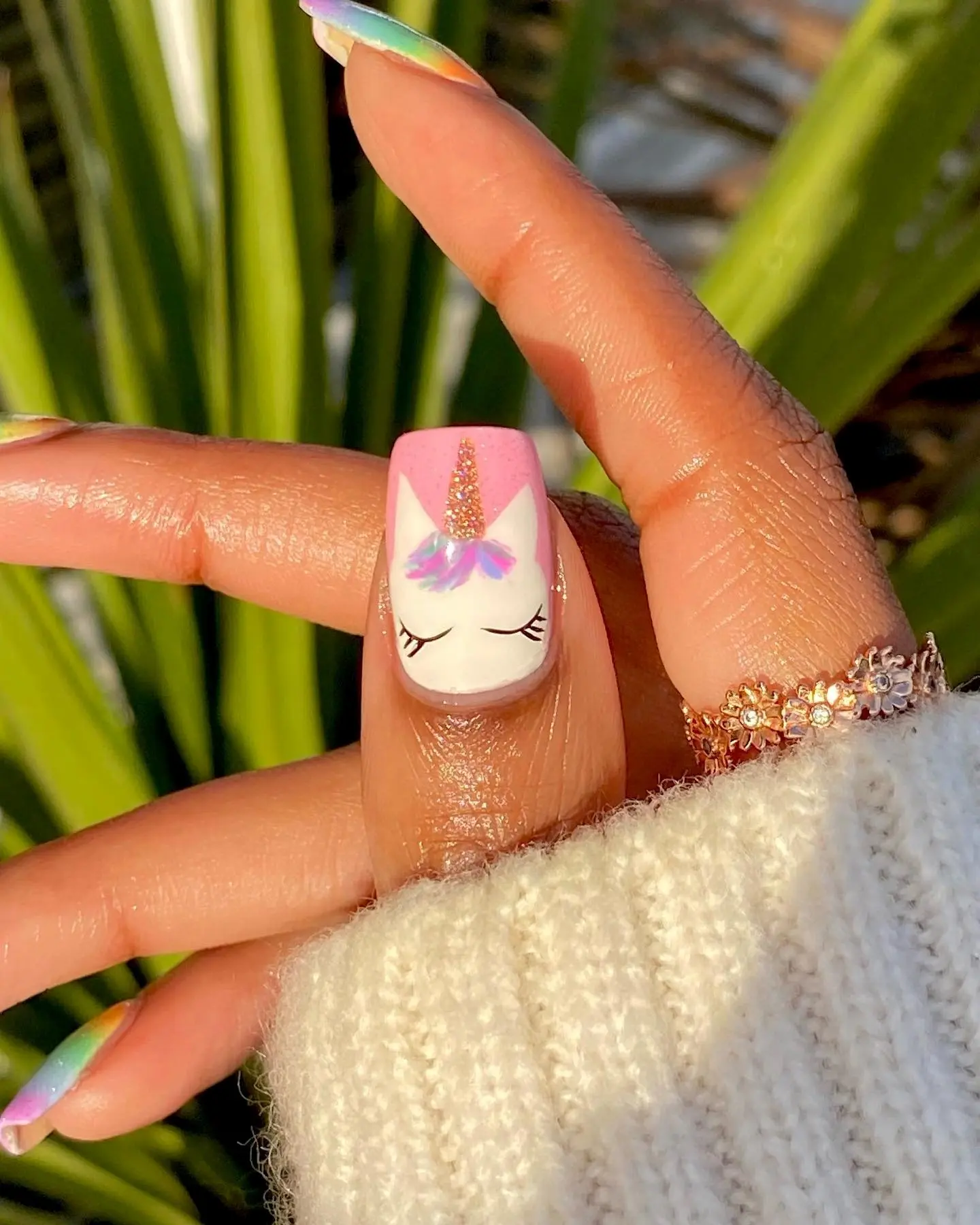 Charming unicorn nails with floral accents