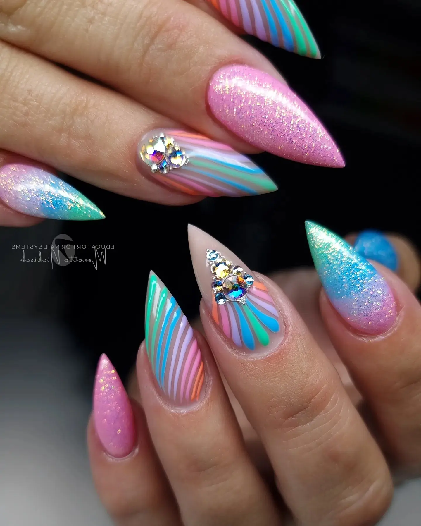 Vibrant unicorn-inspired nail art with shimmer