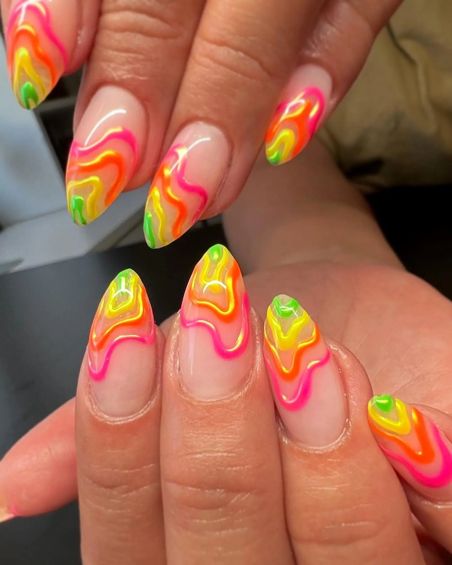 Vibrant unicorn-inspired swirl nail design