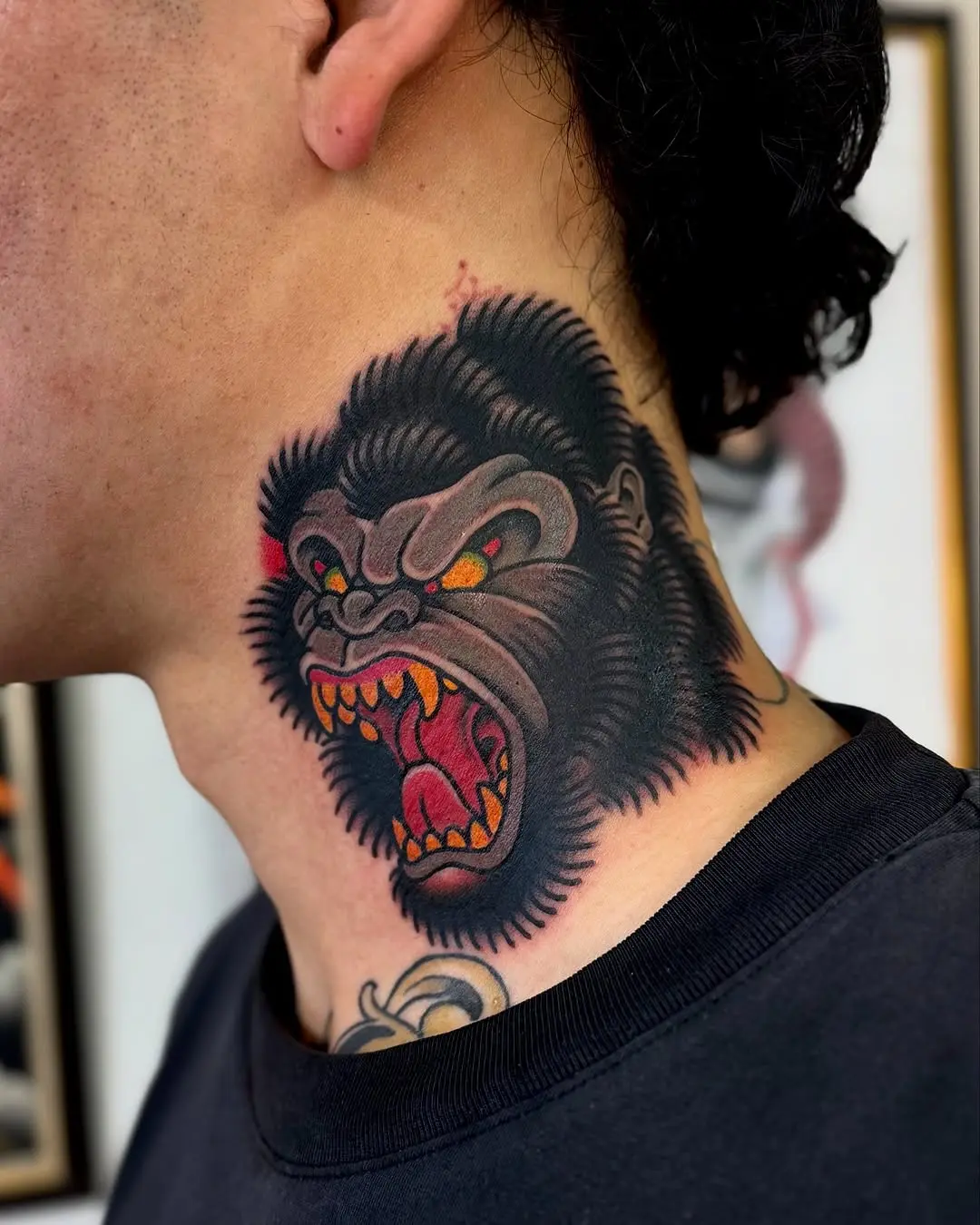 Striking gorilla tattoo on neck inspires boldness