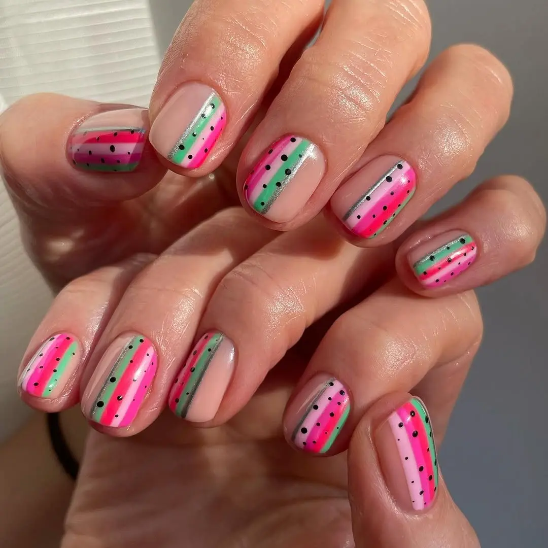 Vibrant watermelon-themed nails for summer vibes