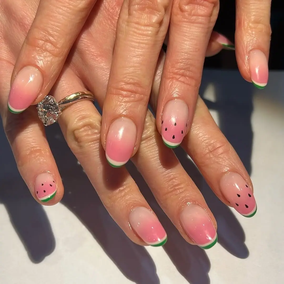 Vibrant watermelon nails with playful accents