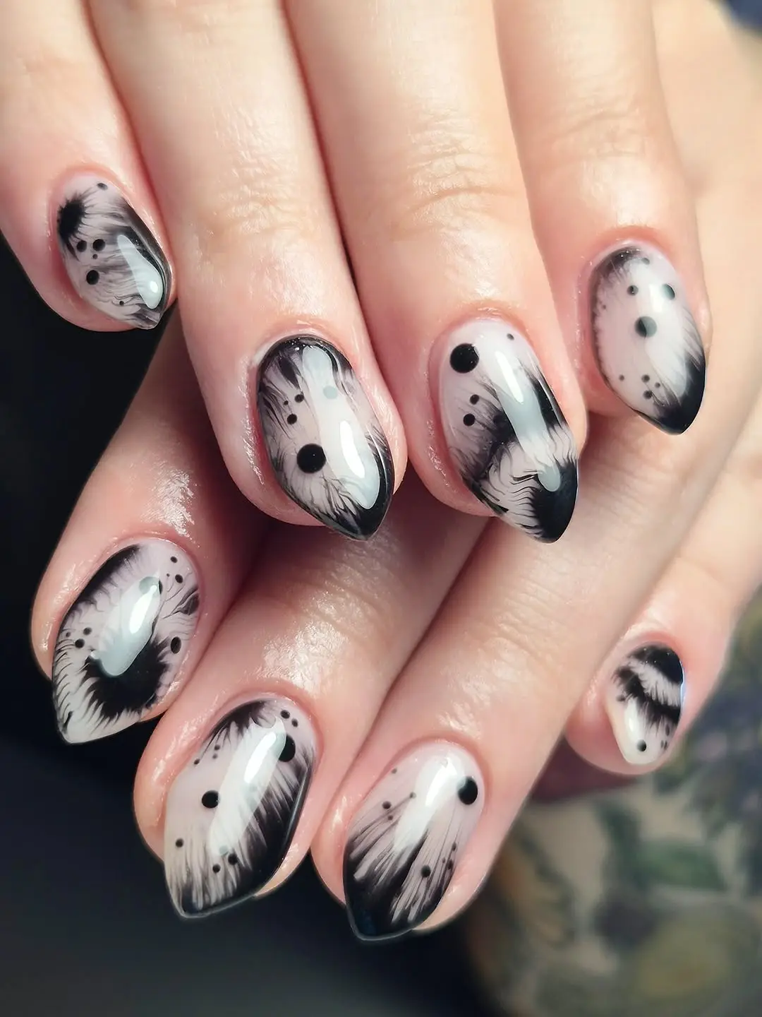 Charming black and white witchy nail art