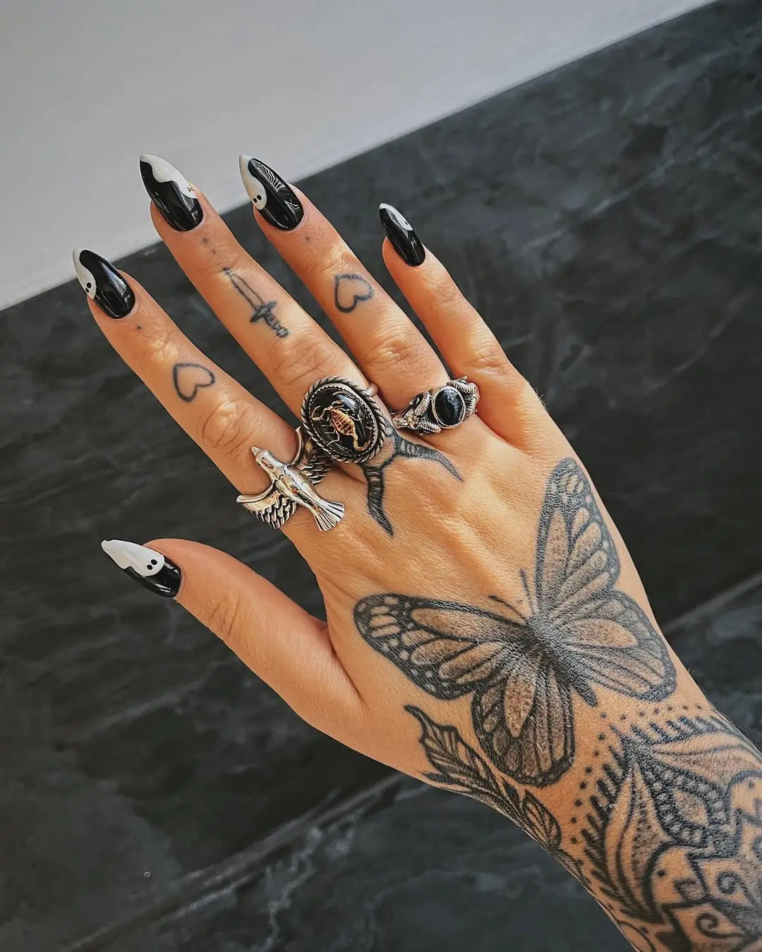 Edgy black and white witchy nail art