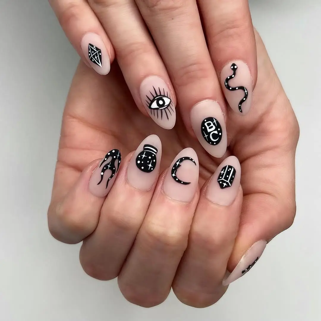 Mysterious black and white witchy nail art