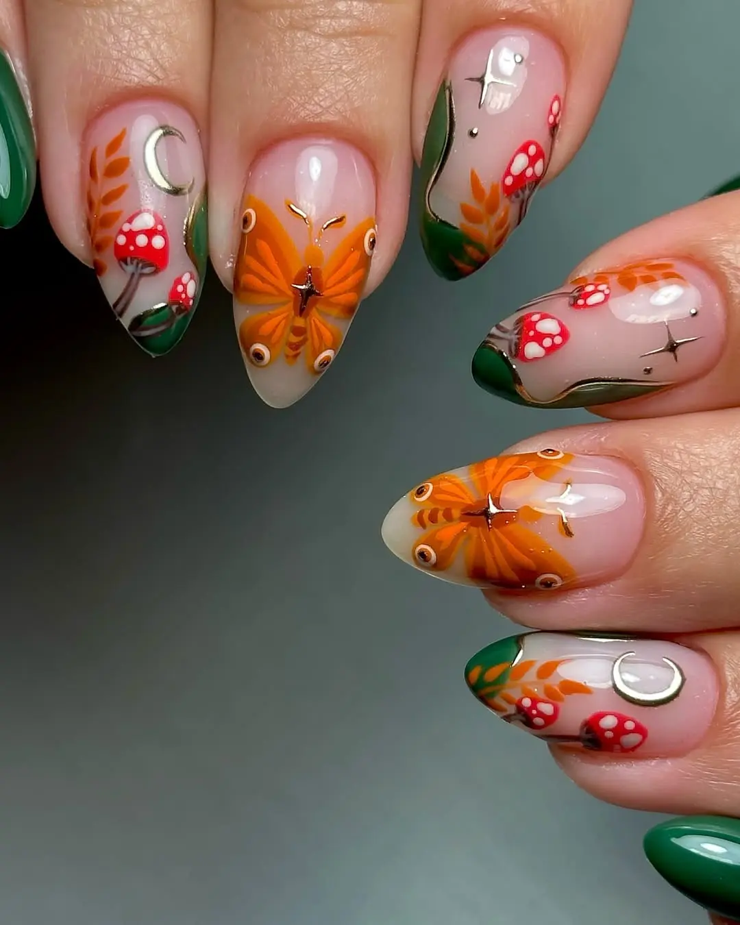 Vibrant witchy nails with butterfly designs