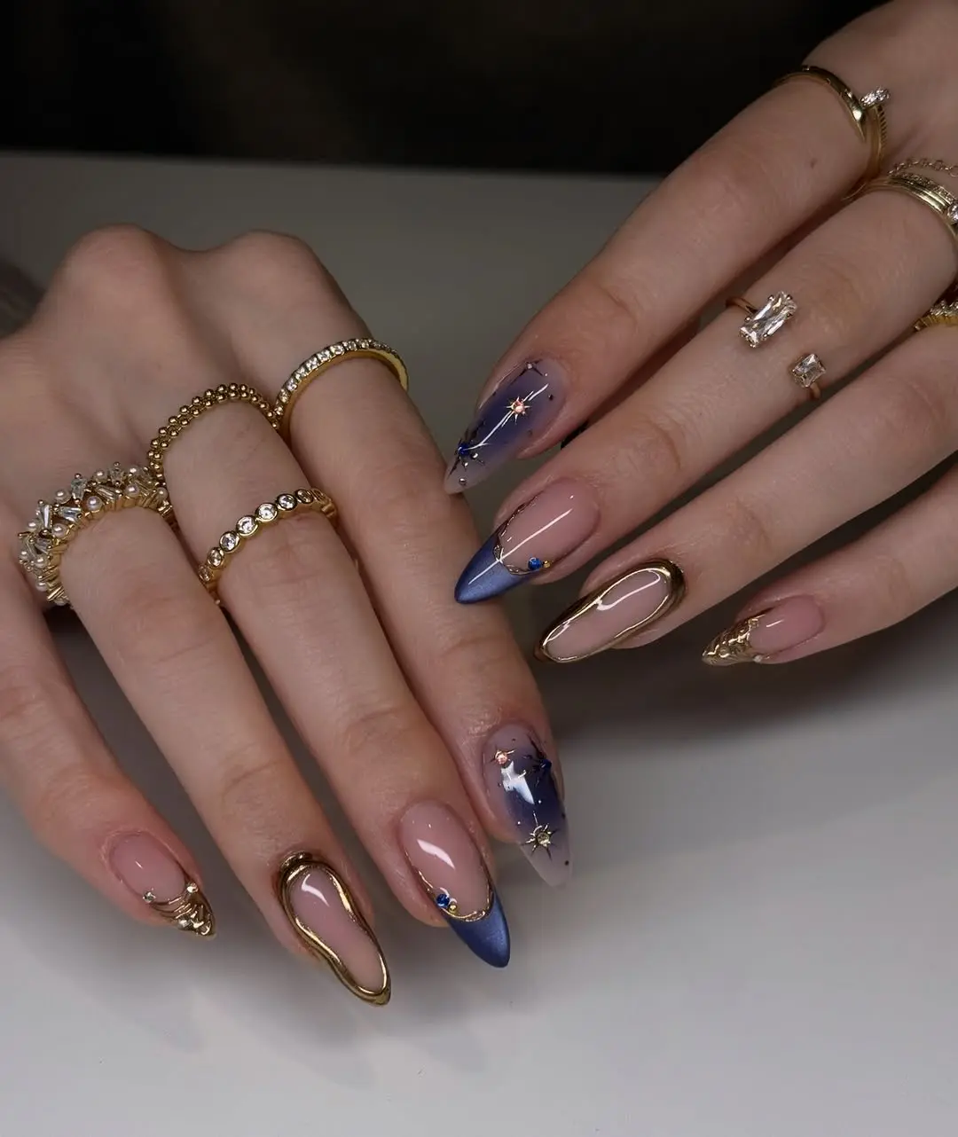 Chic nails with gold and cosmic accents