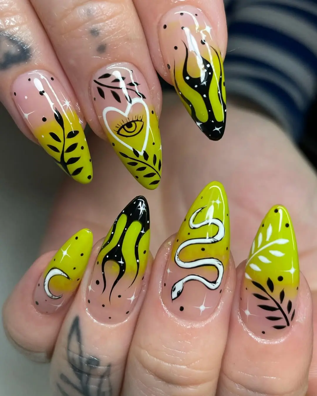 Vibrant witchy green nails with snake motifs