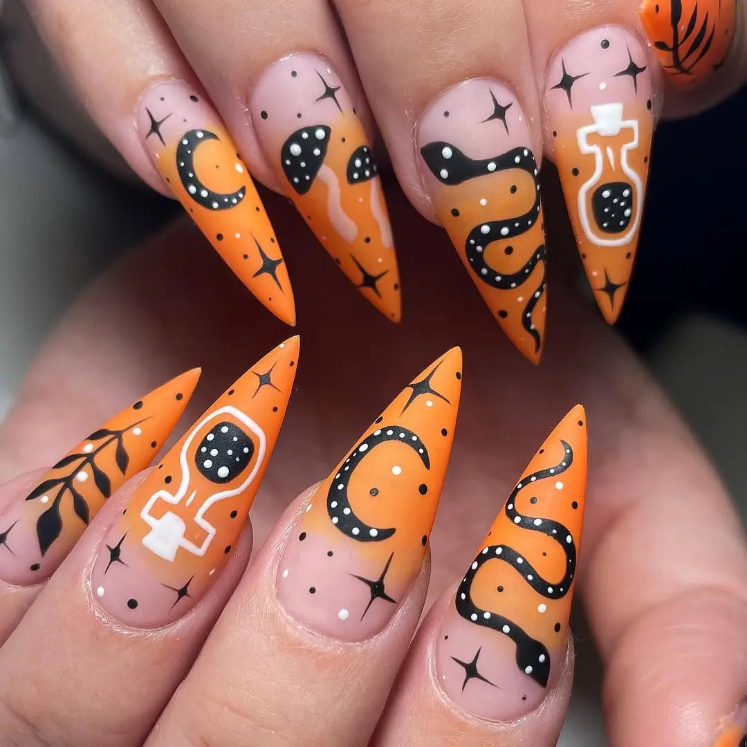 Vibrant Orange and Black Witchy Nail Art