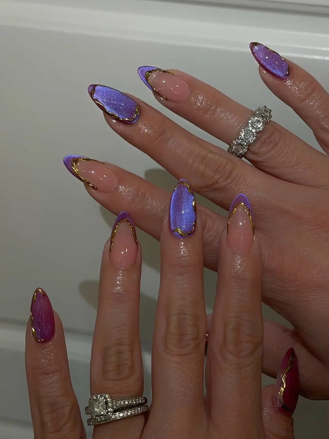 Stylish purple and gold witchy nail design